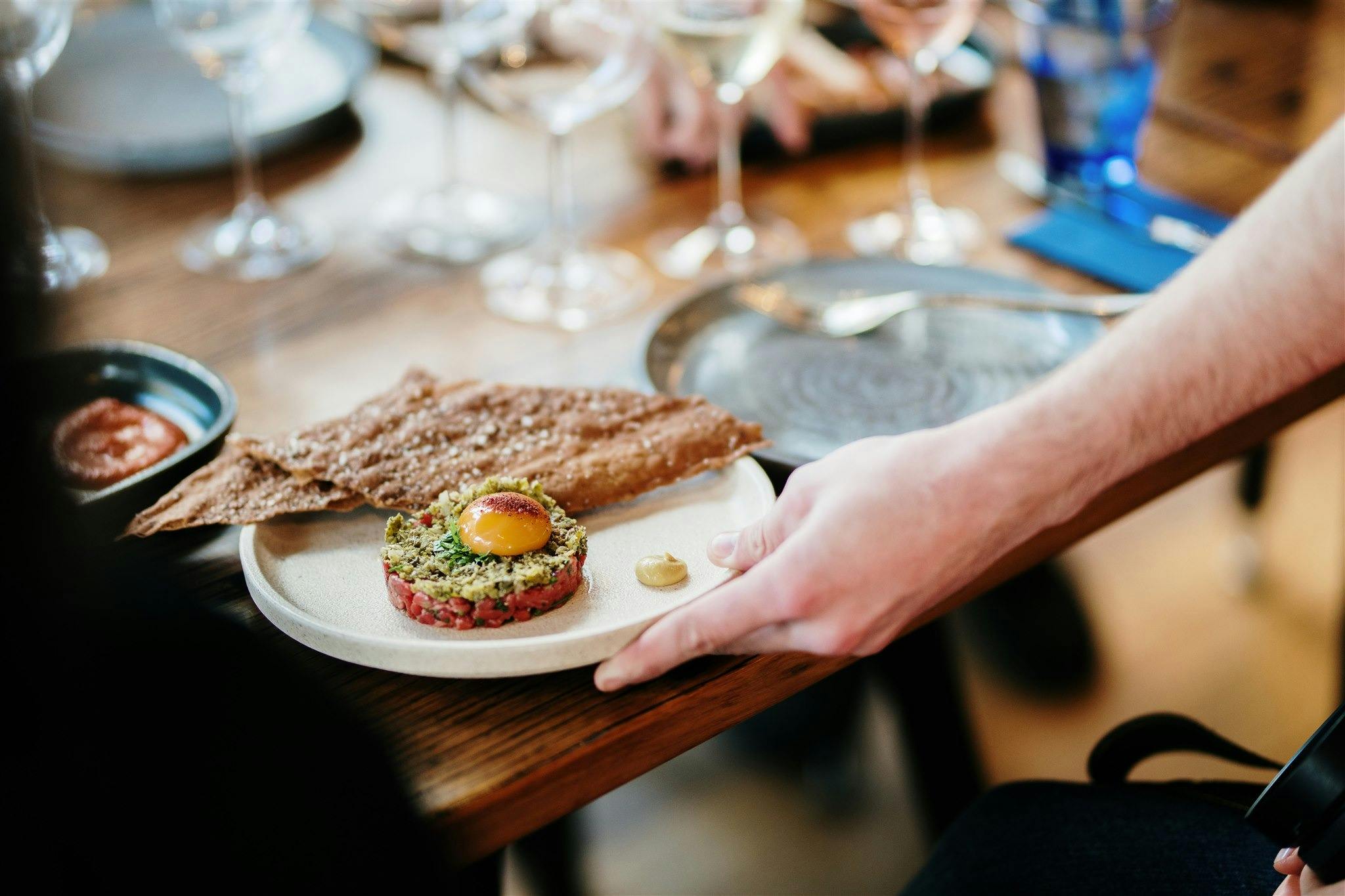 A plate of food being served to a table