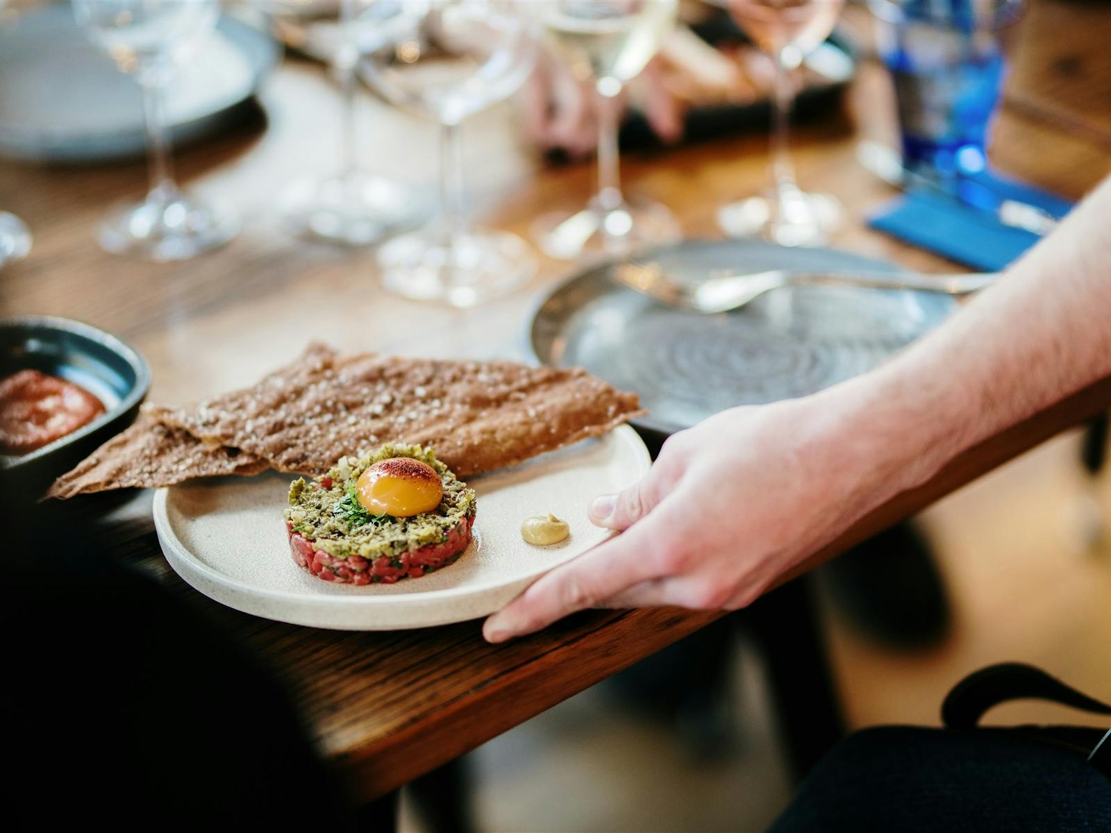 A plate of food being served to a table