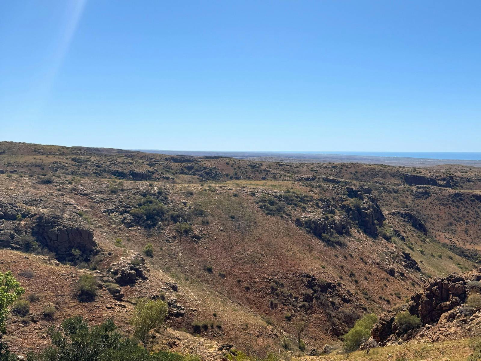 Panoramic view of Charles Knife Canyon with rugged red cliffs and winding gorge