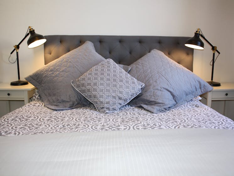 Bed with luxury cushions and linen