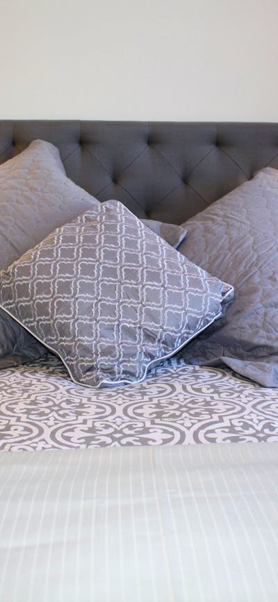 Bed with luxury cushions and linen