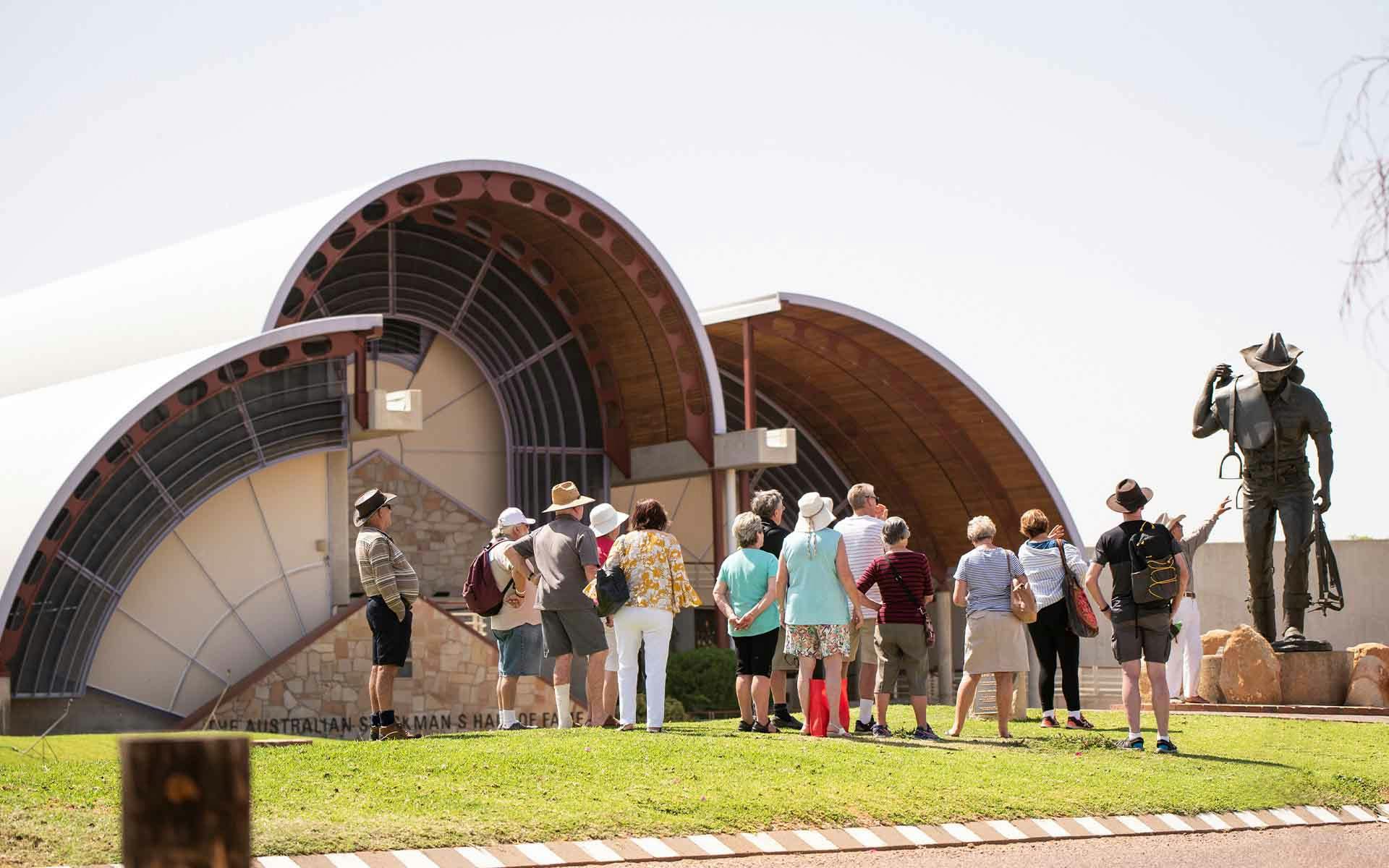People standing on the lawn outside the Australian Stockman's Hall of Fame