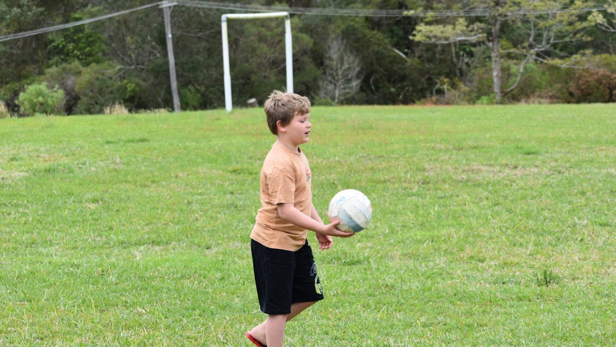 kid playing ball