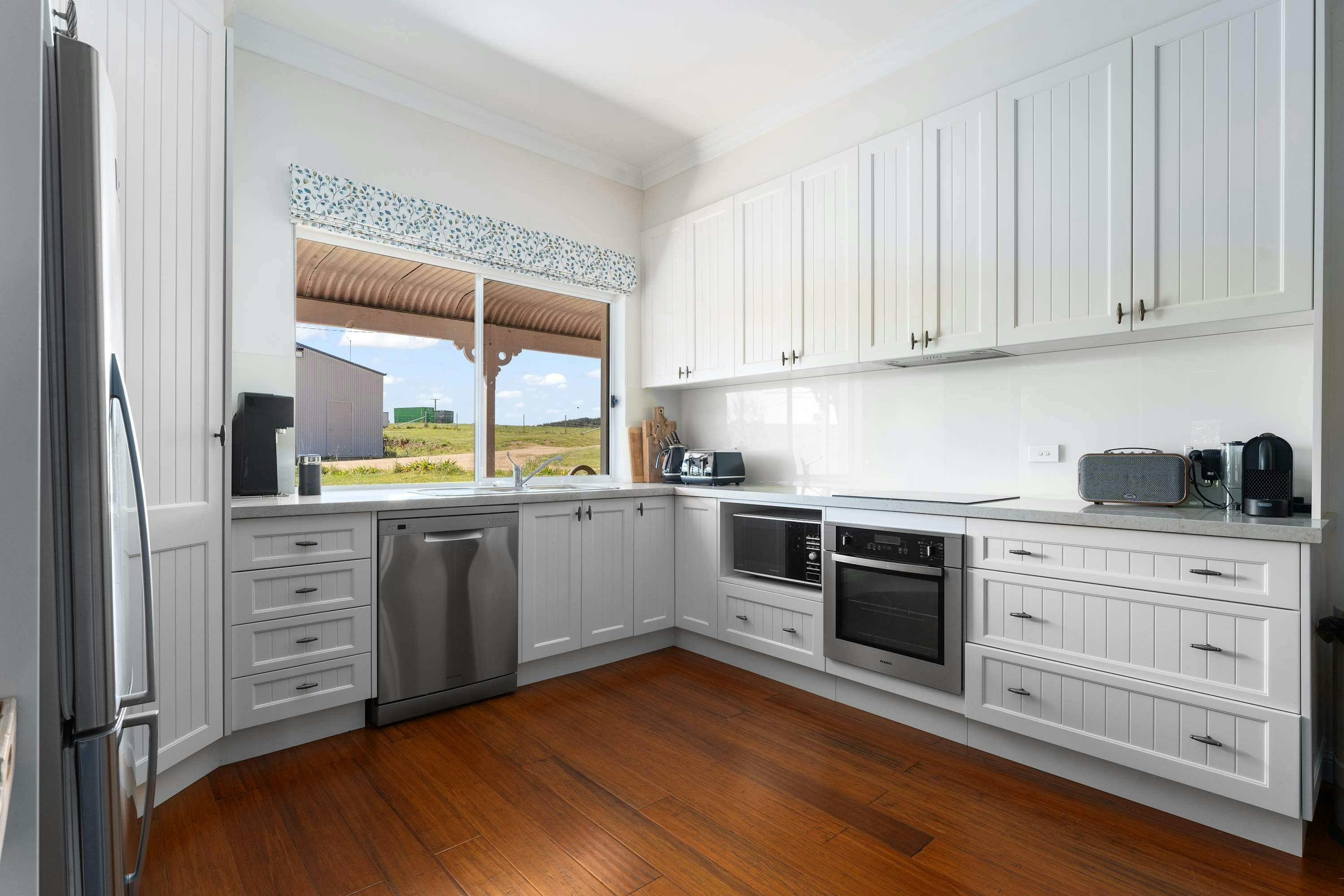 Kitchen with appliances and views