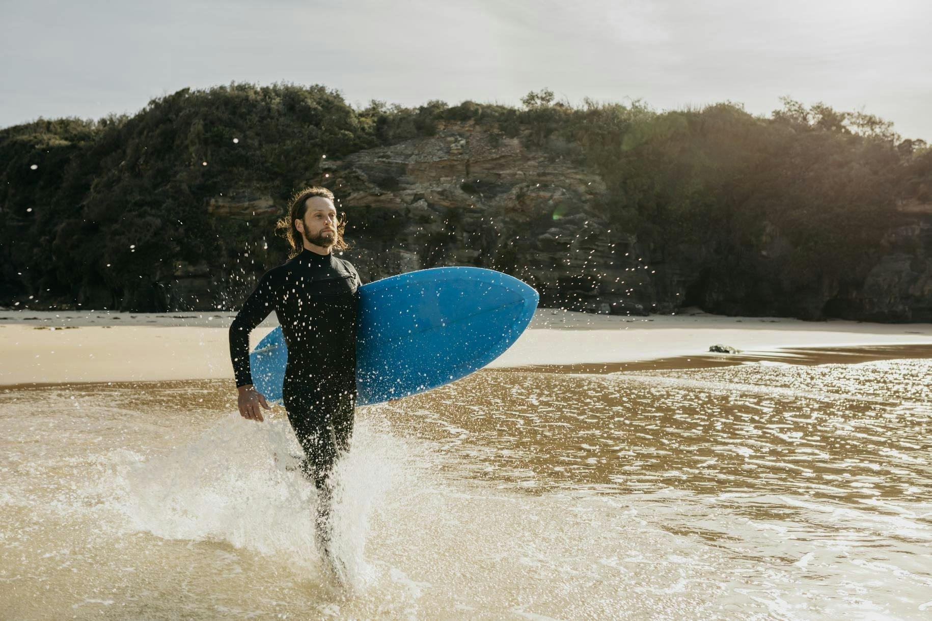 Surfer at Rennies Beach