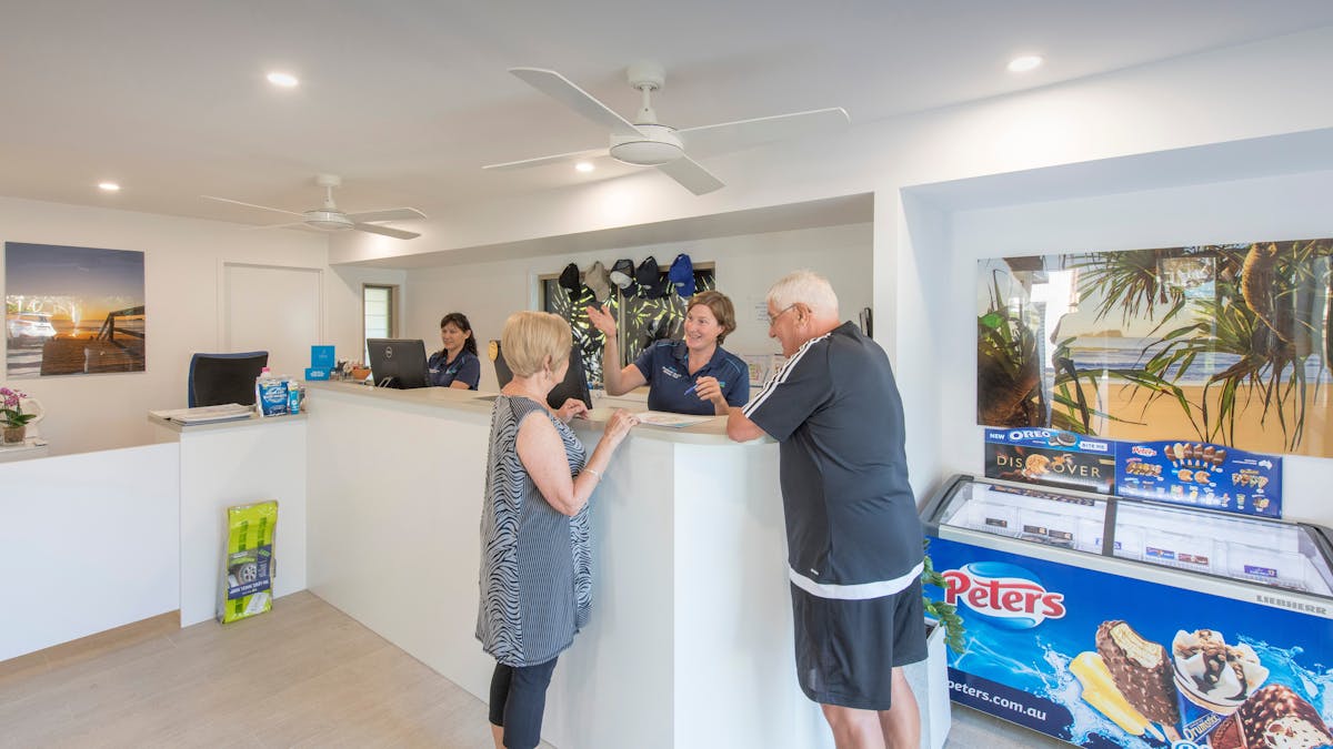 Image of Mudjimba Beach Holiday Park Office with staff and guests checking in