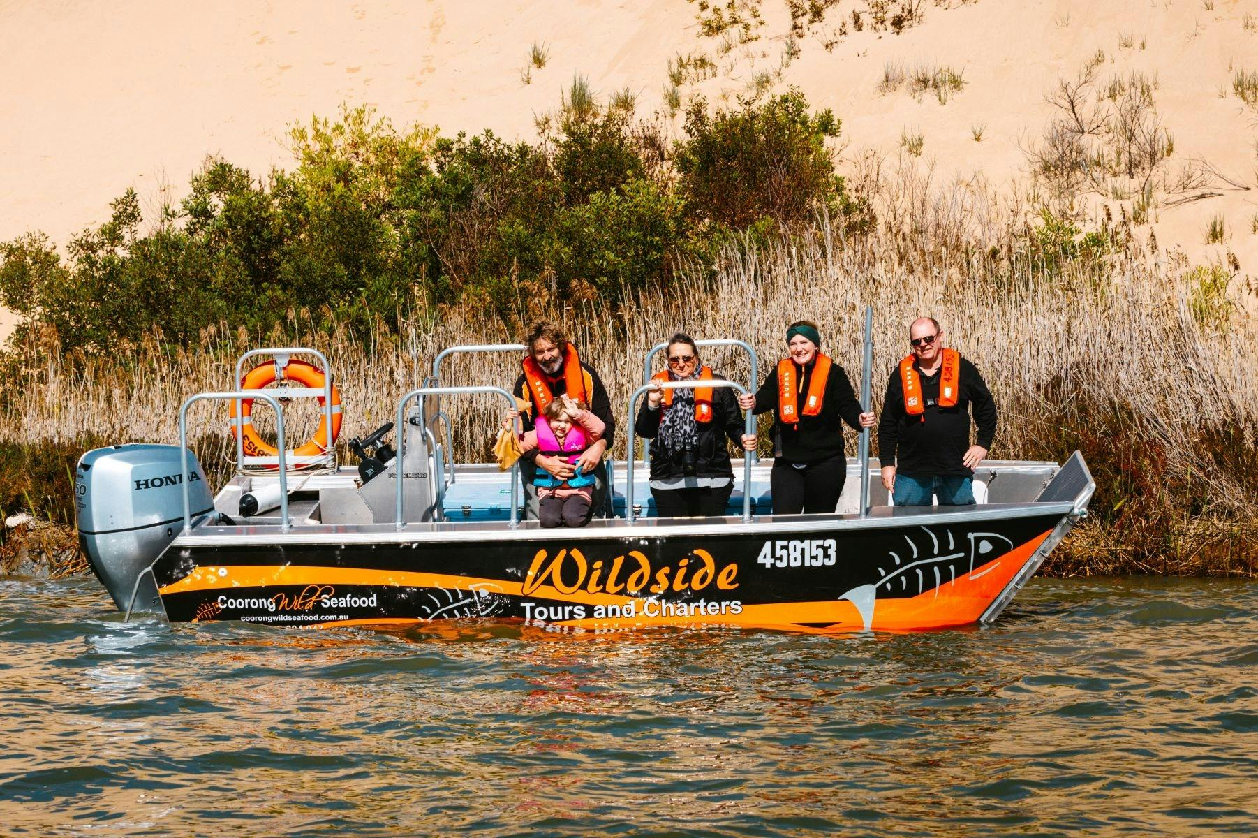Happy group of tourists on the Wildside near a Sandhill on the Coorong