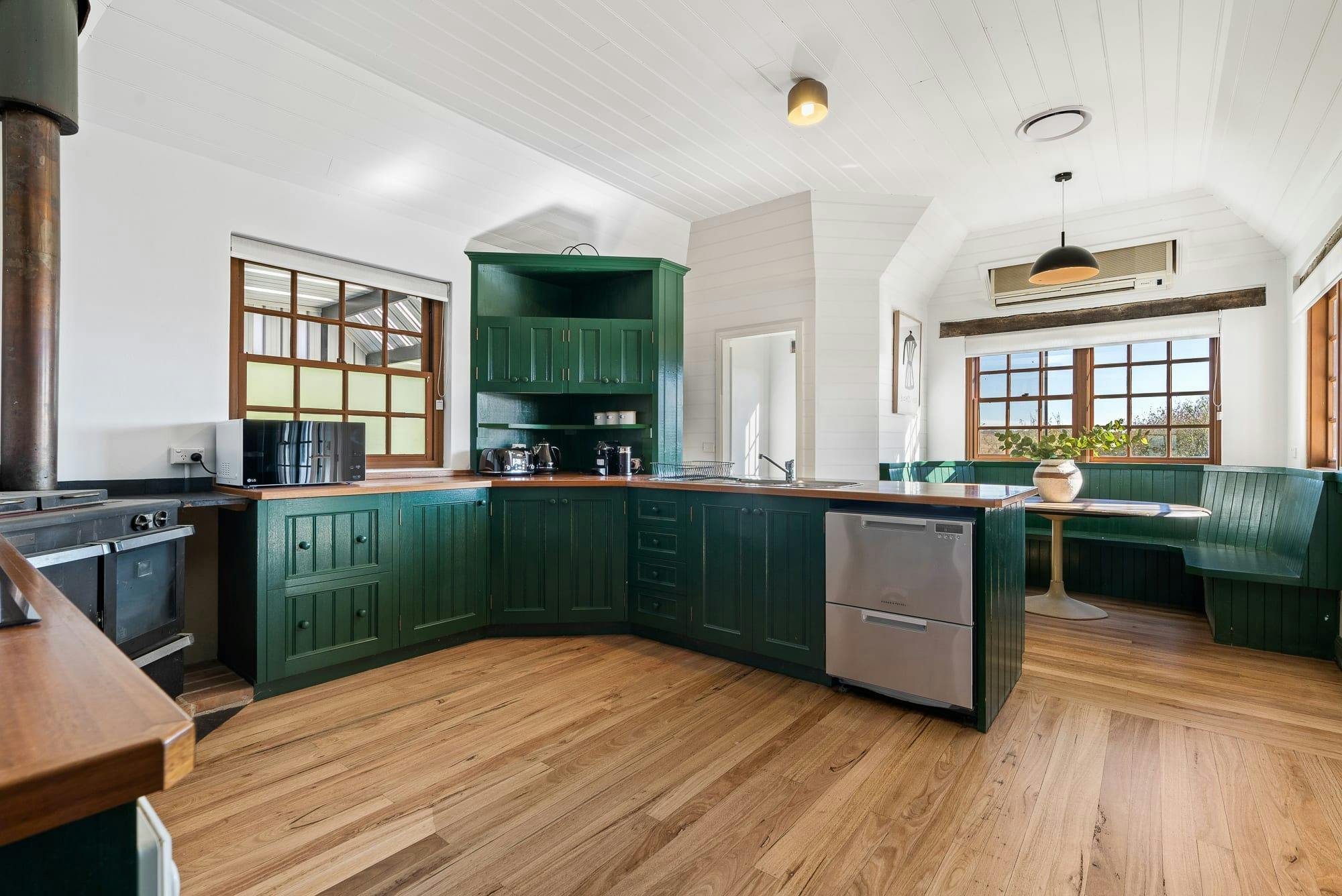 Dark Green kitchen with breakfast nook and pantry