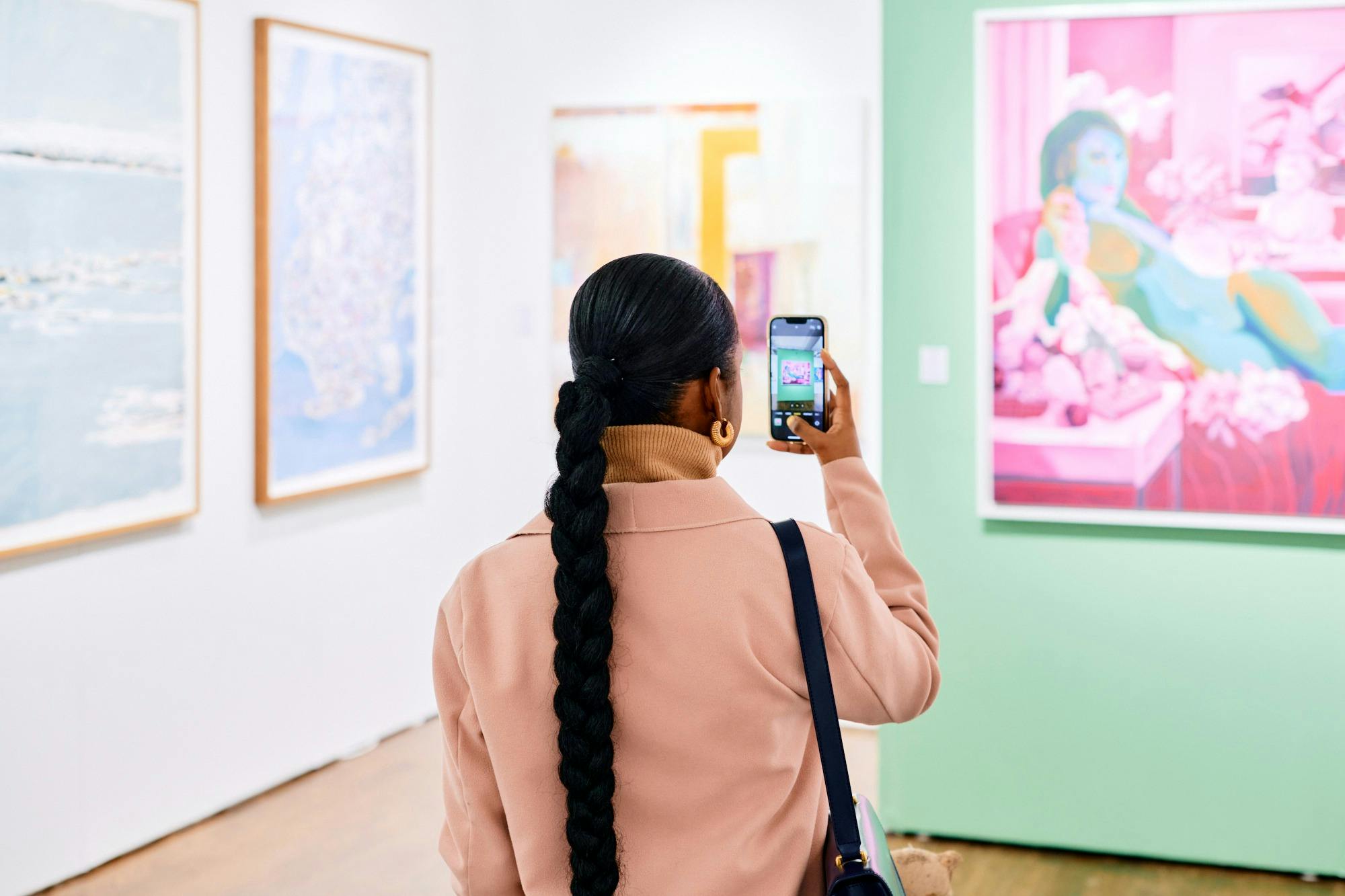 Person taking photo of artwork.