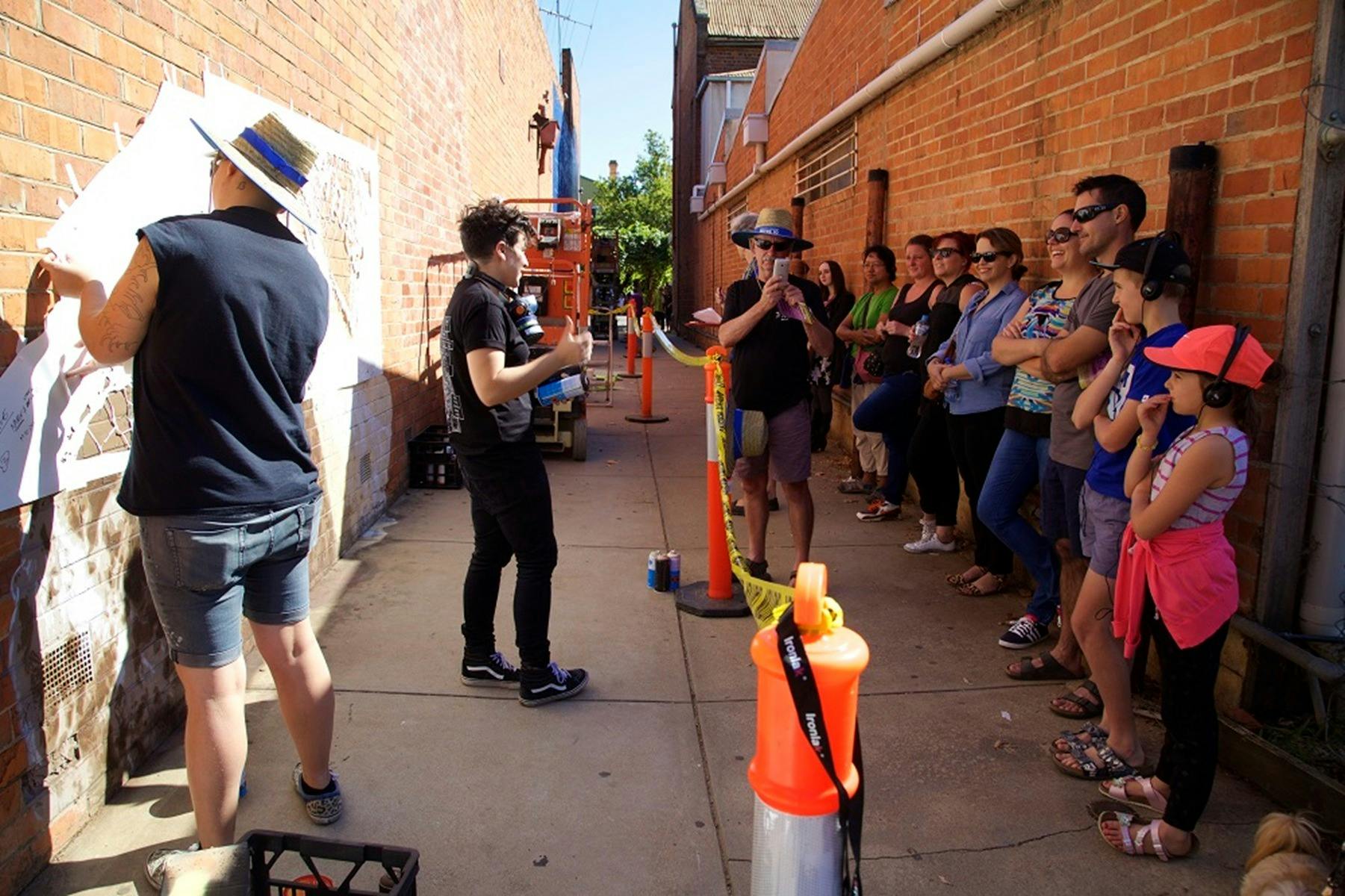Visitors watching artists during past Benalla Street Art Festivals