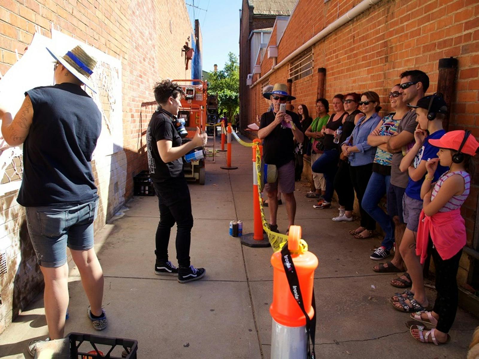 Visitors watching artists during past Benalla Street Art Festivals