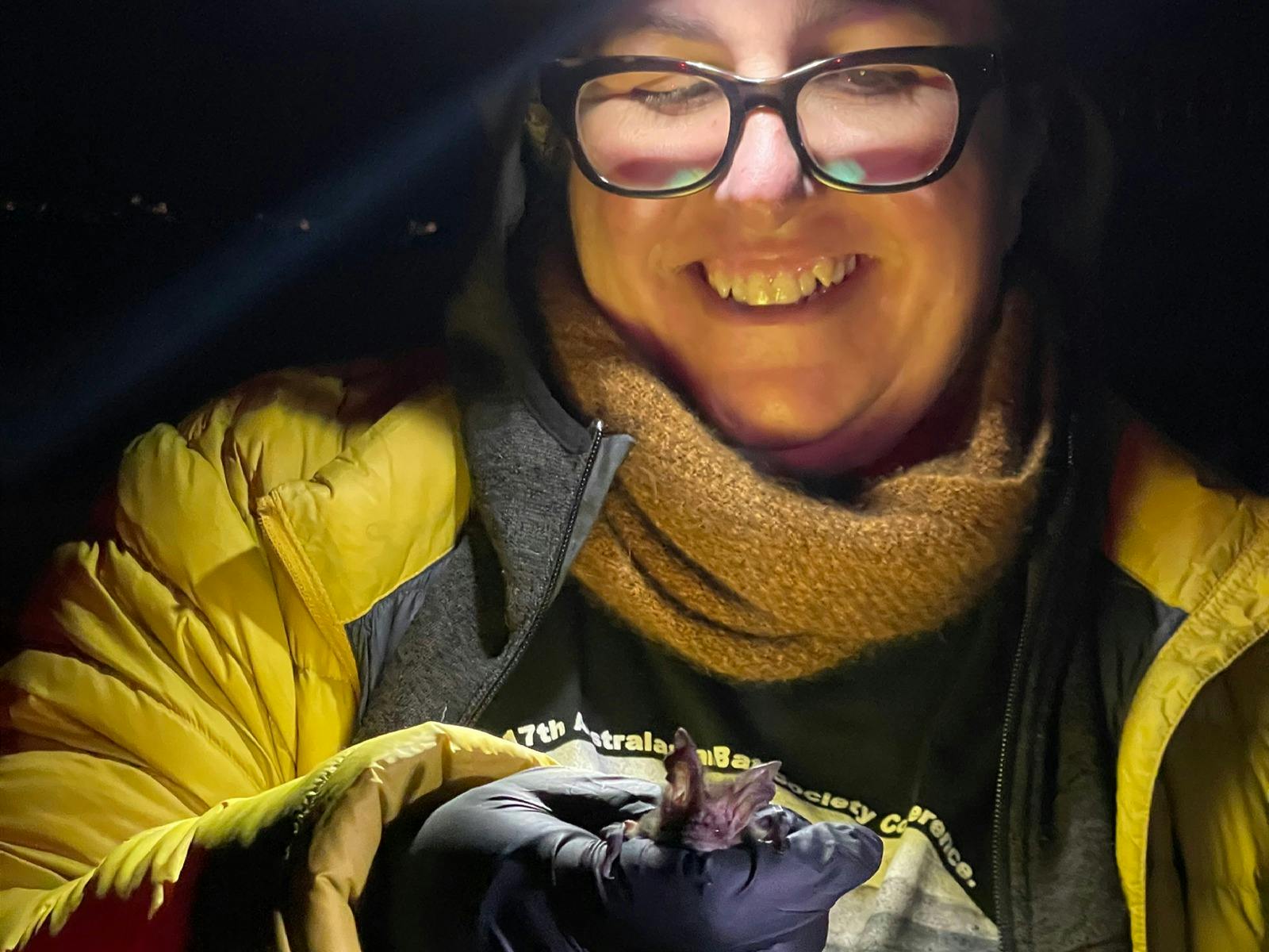 An image of Dr Lisa Cawthen holding a bat.