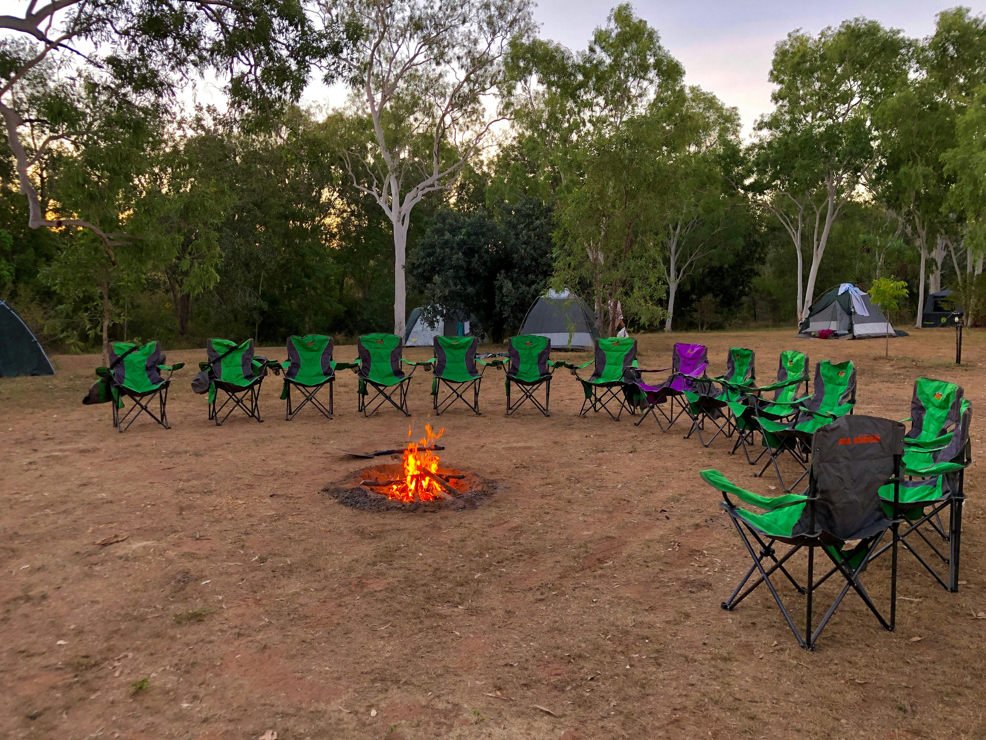 campfire with chairs around it