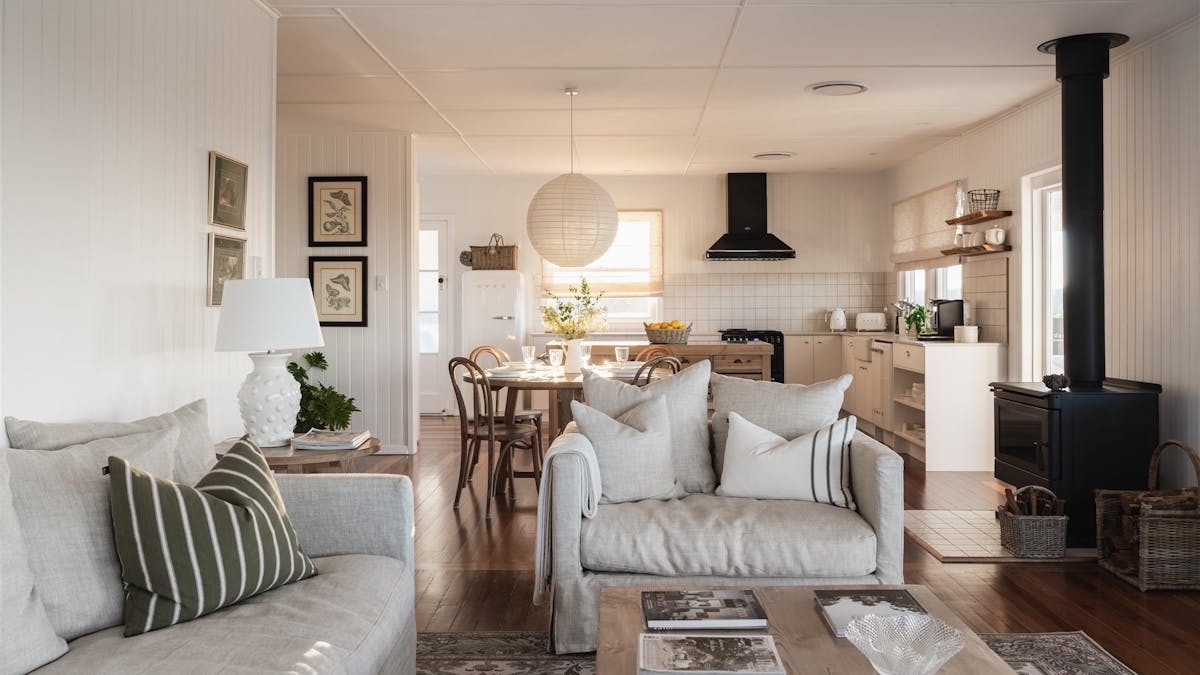 The open plan kitchen, dining and living area. With views from every window. The open plan kitchen, dining and living area. With views from every window.