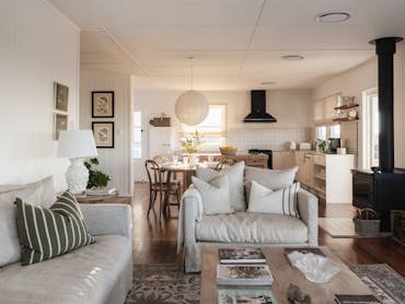 The open plan kitchen, dining and living area. With views from every window. The open plan kitchen, dining and living area. With views from every window.