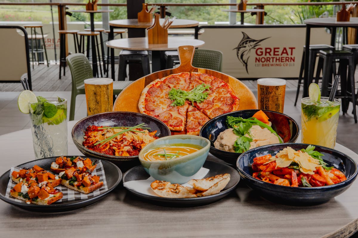 Pizza, pasta, soup, bruschetta, beer and cocktails on a table at Orion Hotel Springfield