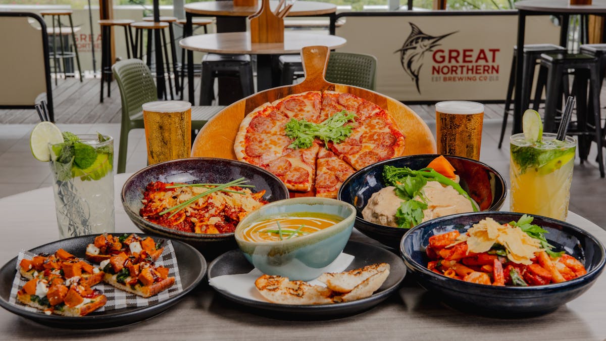 Pizza, pasta, soup, bruschetta, beer and cocktails on a table at Orion Hotel Springfield