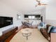 Hester arthouse townhouse living area with couch, television, tea table and dining table