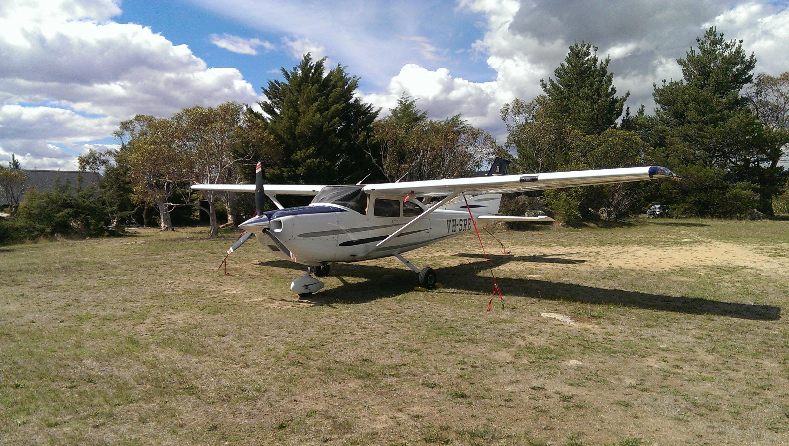 Aircraft can park next to Runway View Cottage.