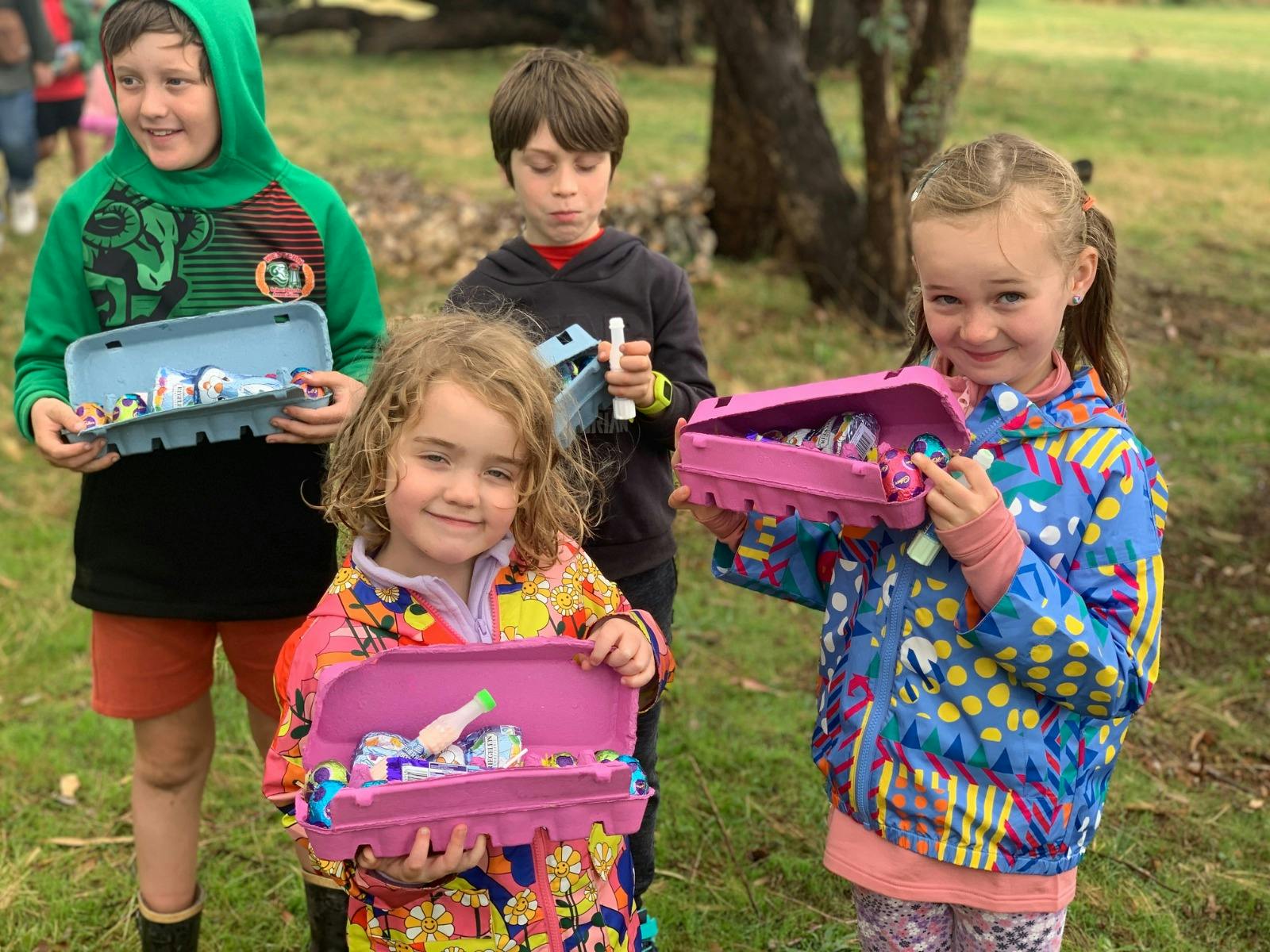 4 kids showing off their easter hunt prizes at Stockman's Ridge Wines