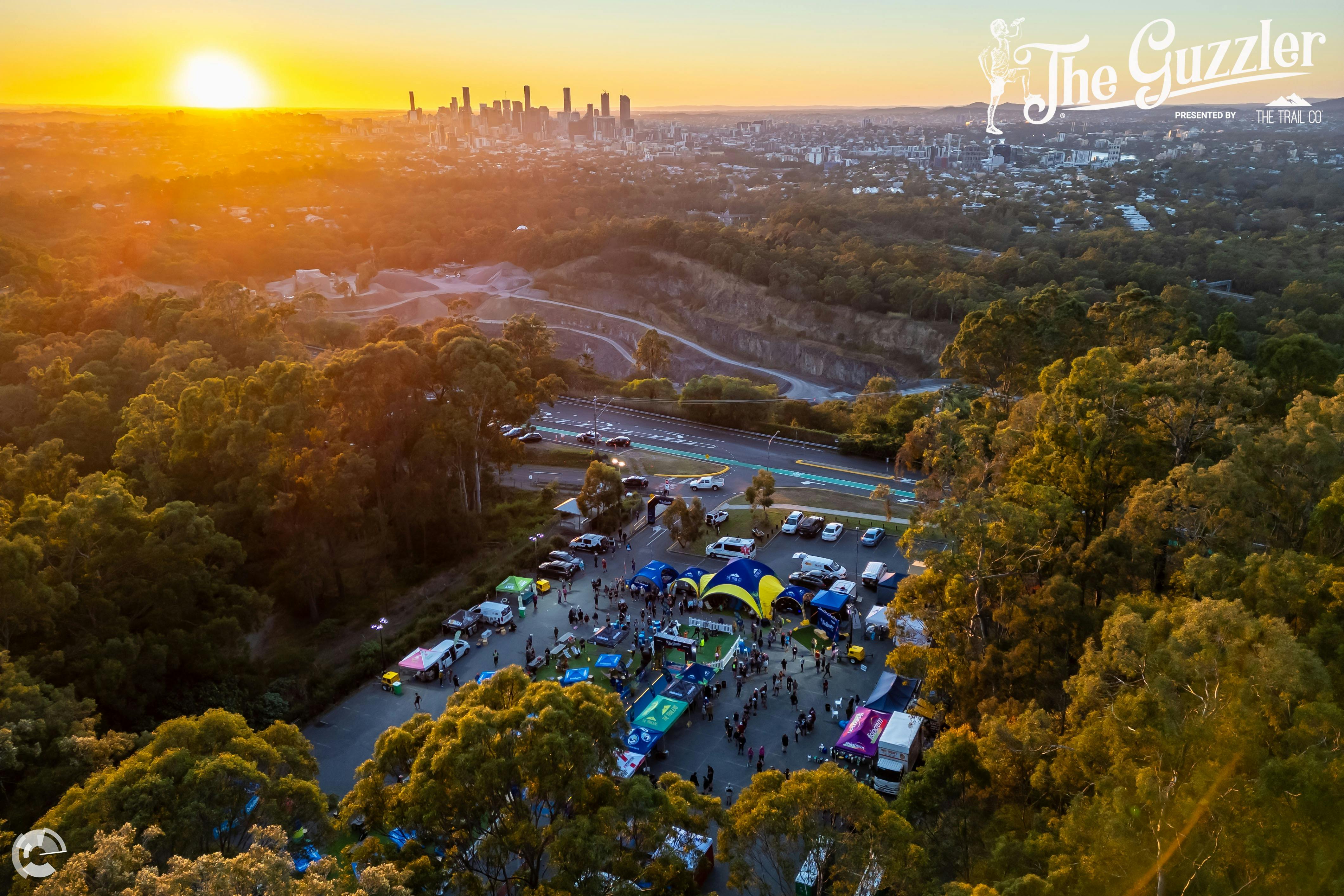 The sun rises over Brisbane city as runners prepare for the start of The Guzzler
