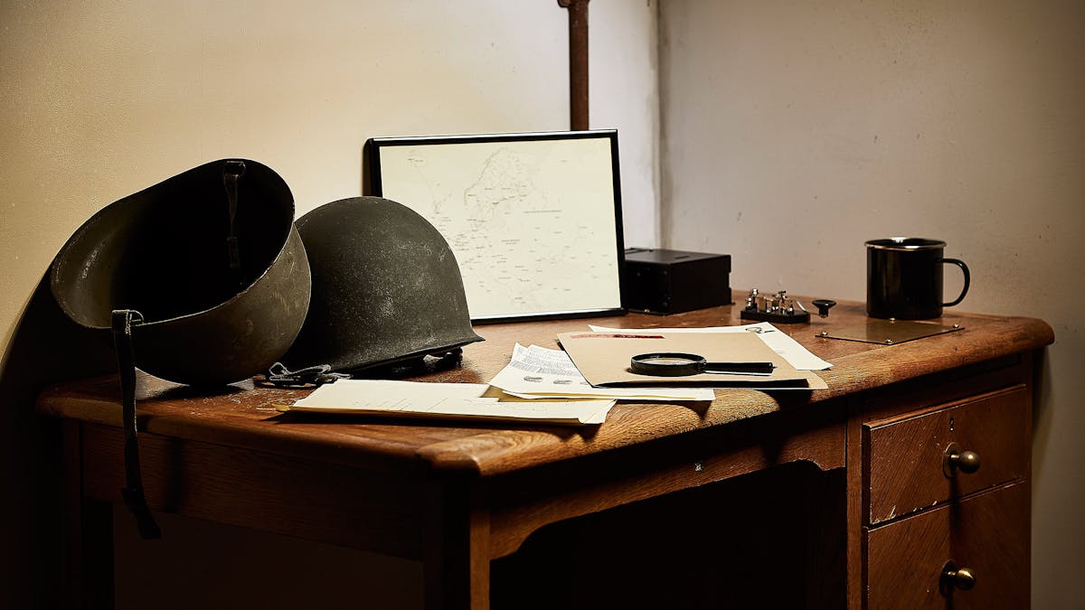 Mysterious World War 2 props and clues on an antique table