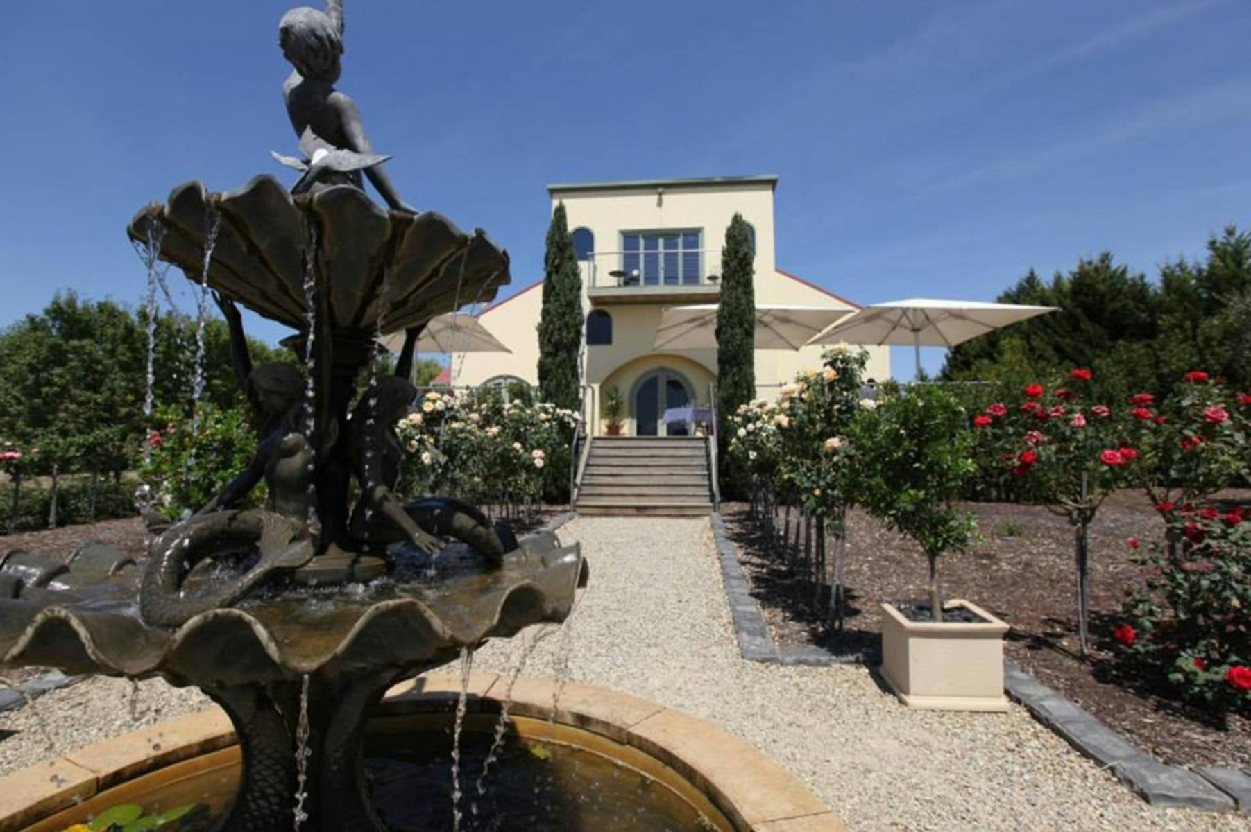 Tokar Estate winery viewed from the garden with fountain in the foreground