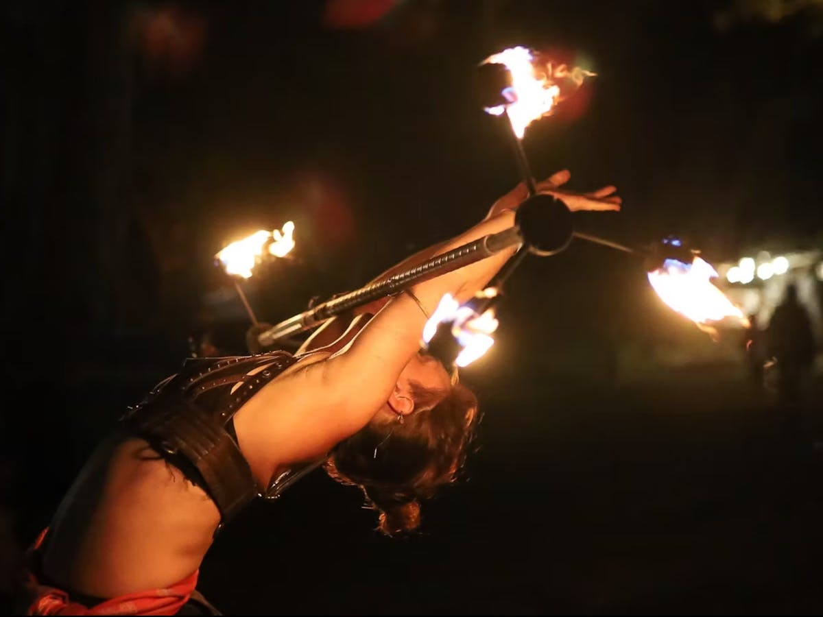 A fire twirling performer at Kuranda Roots Festival in Mareeba, Far North Queensland.