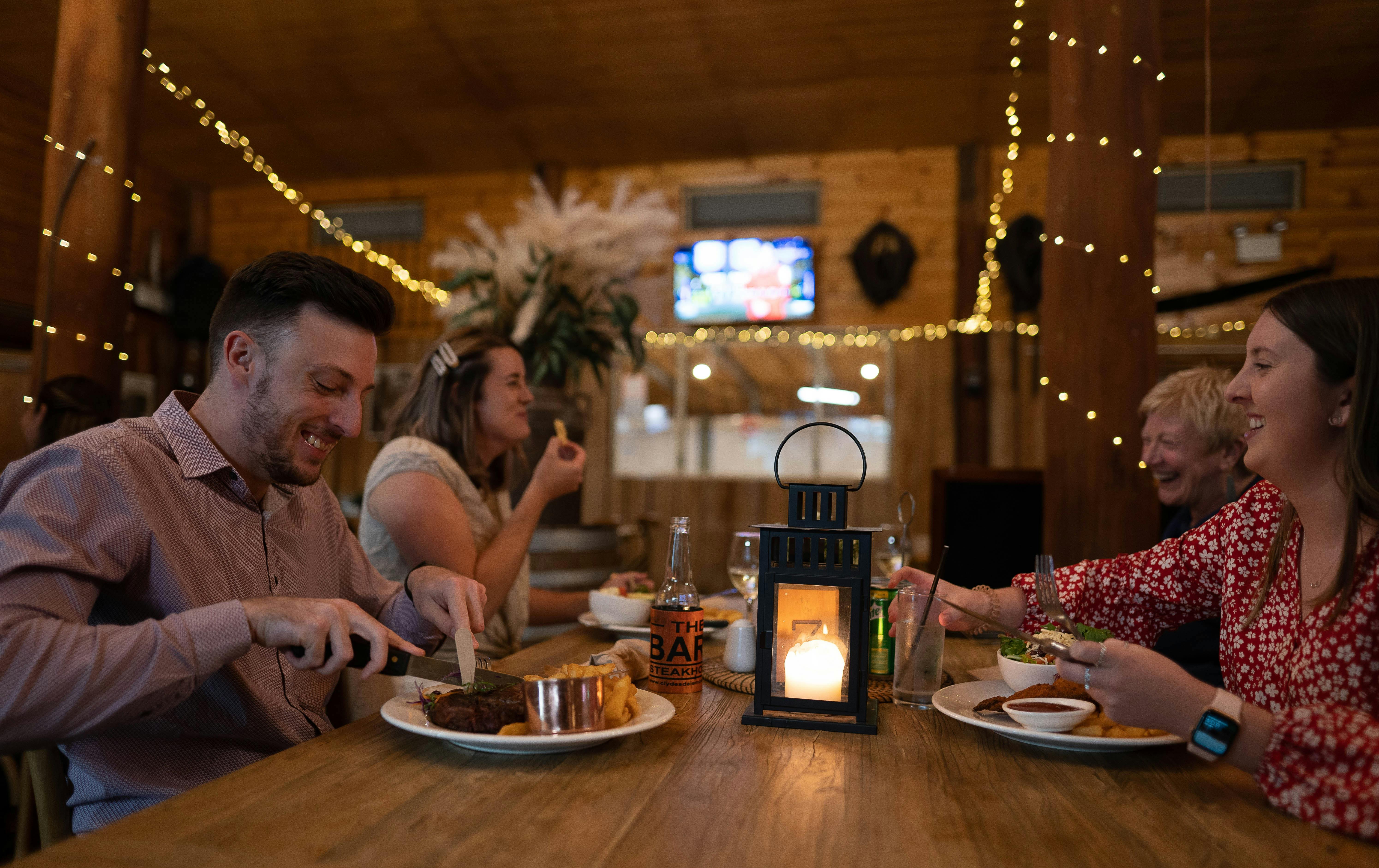 People enjoying dinner at stakehous