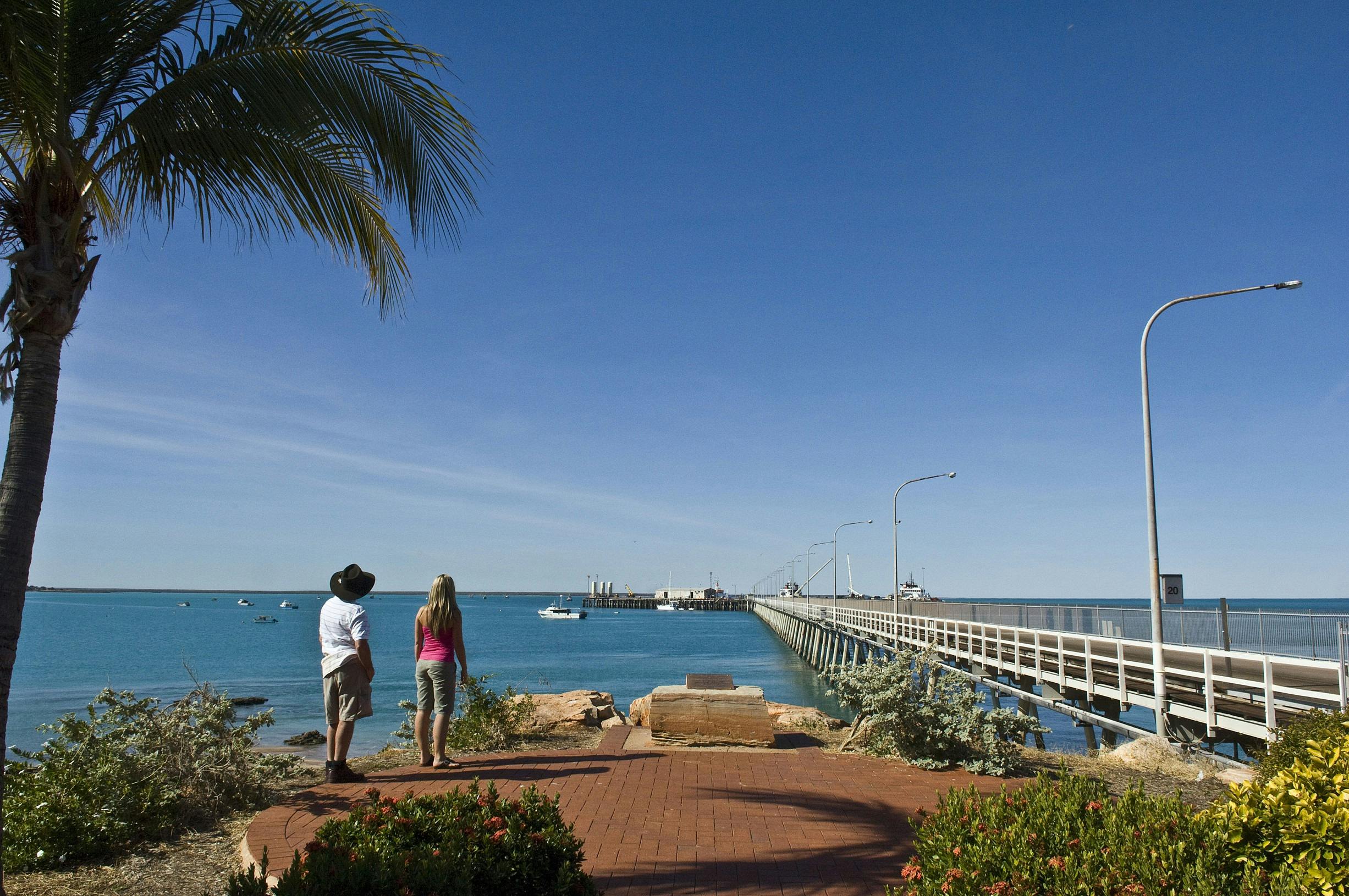 Couple overlooking the Broome Jetty and Roebuck Bay