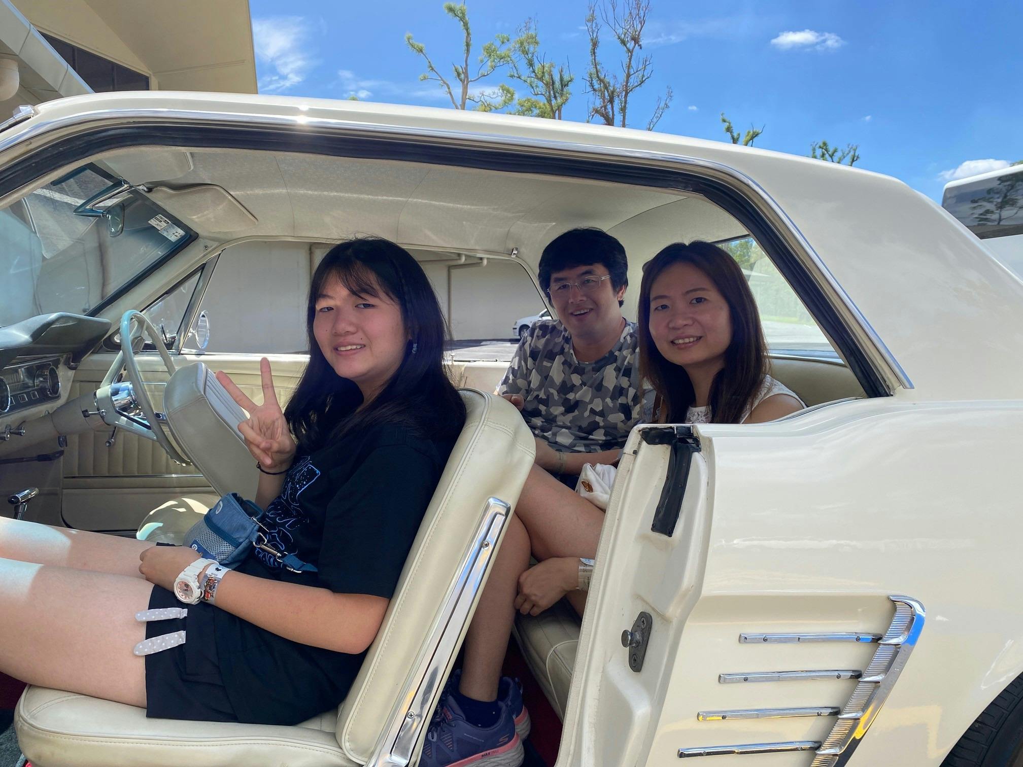 enjoying a classic car ride