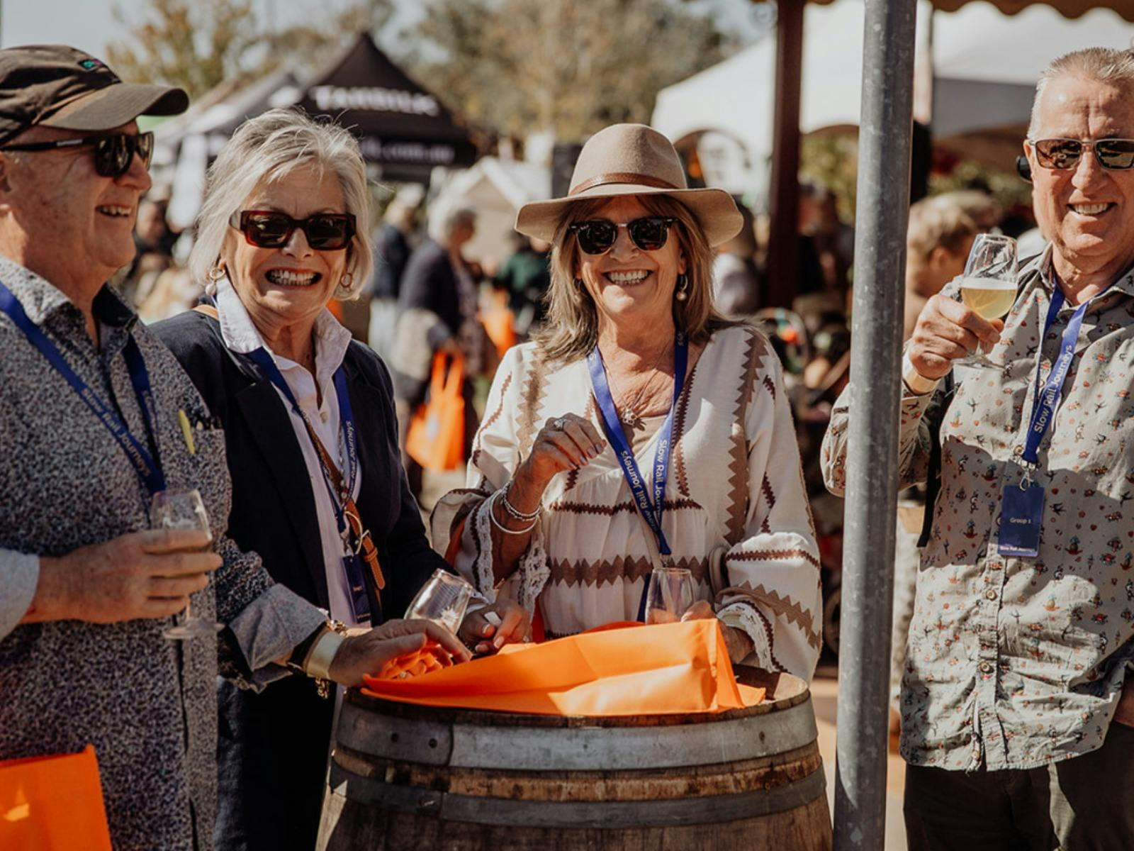 four people enjoying wine