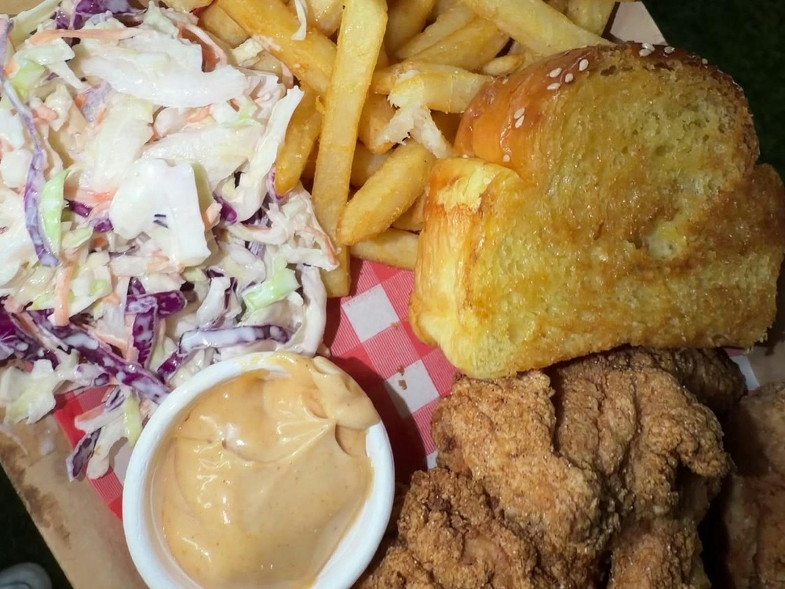 Chicken tender box with tenders, fries, coleslaw, Texas toast and dipping sauce