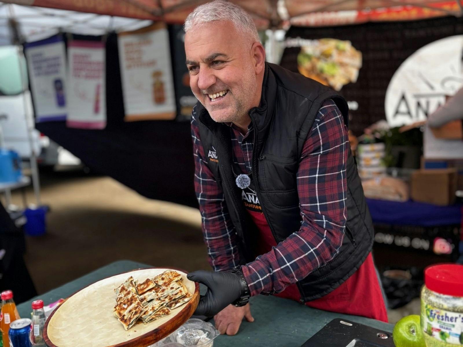 A man holding out a plate of food