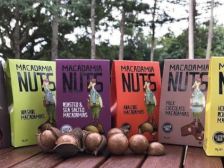Duck Creek Macadamia Products in a line with nuts in front