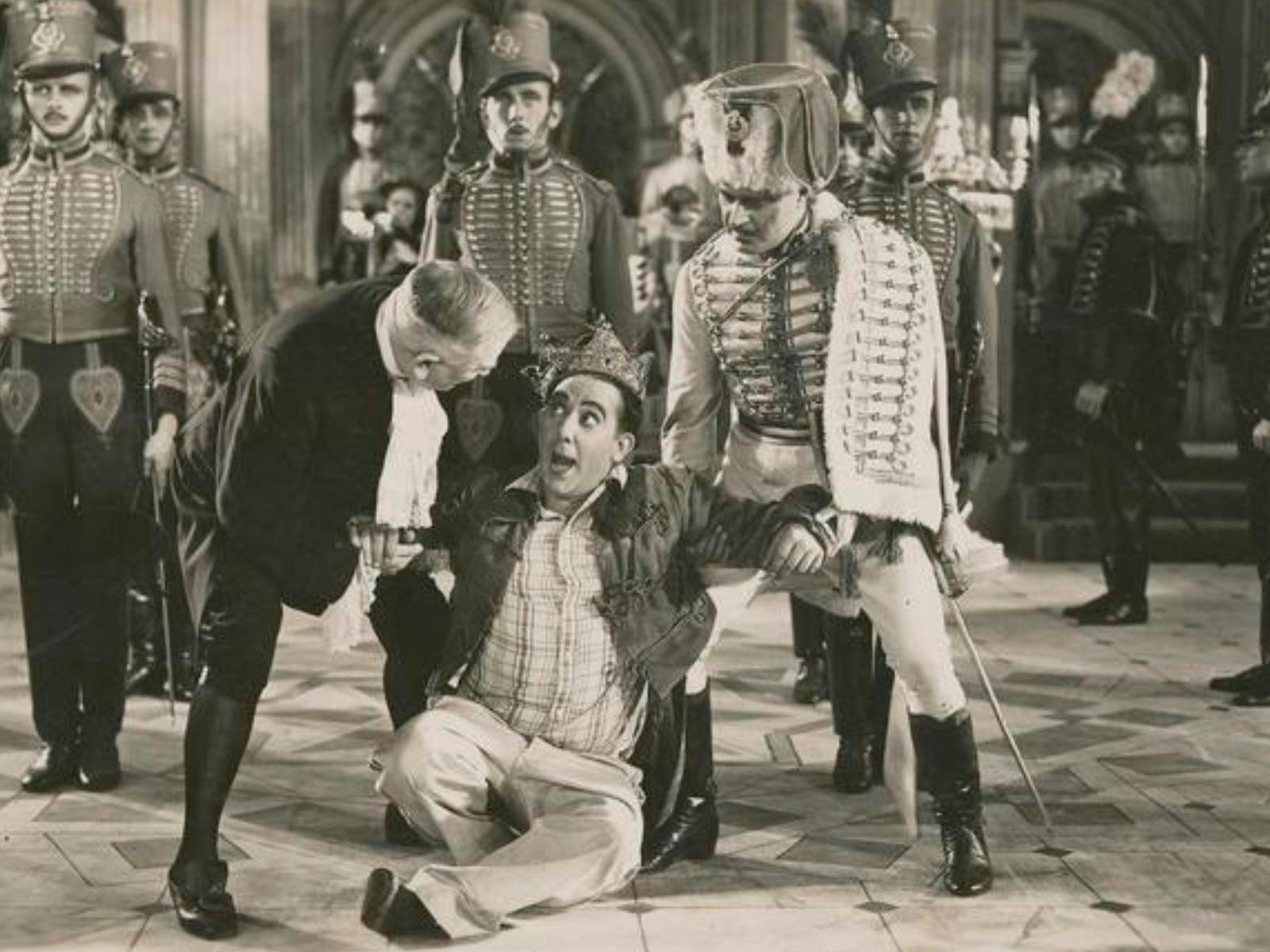 Black and white image of men dressed as royals