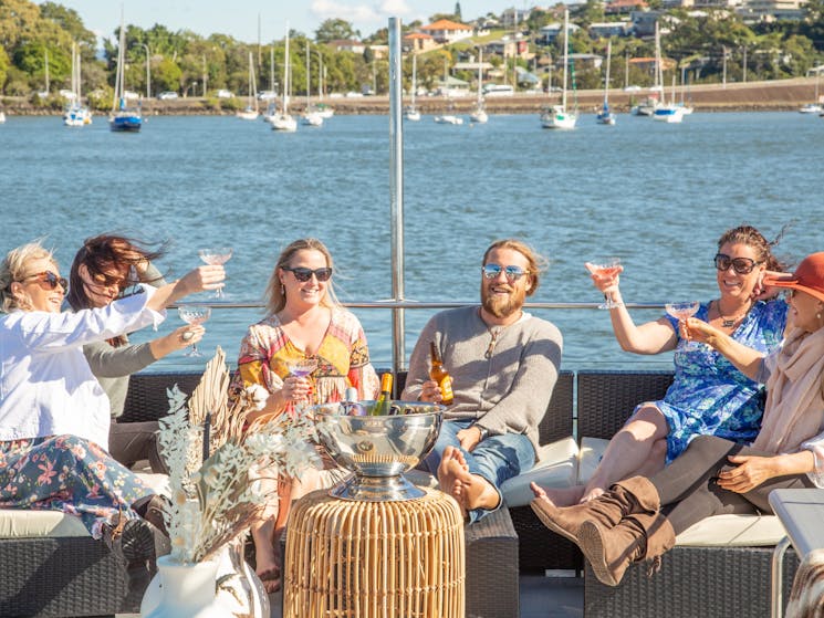 relaxing with a drink the most scenic cruise from the Gold Coast to Byron Bay, cruise into nature.