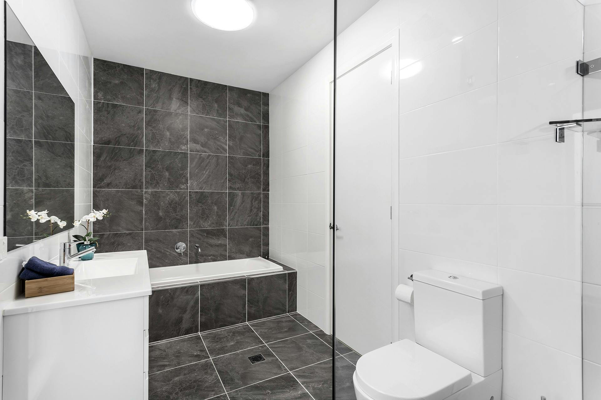 Family bathroom with walk-in shower and full sized bath tub