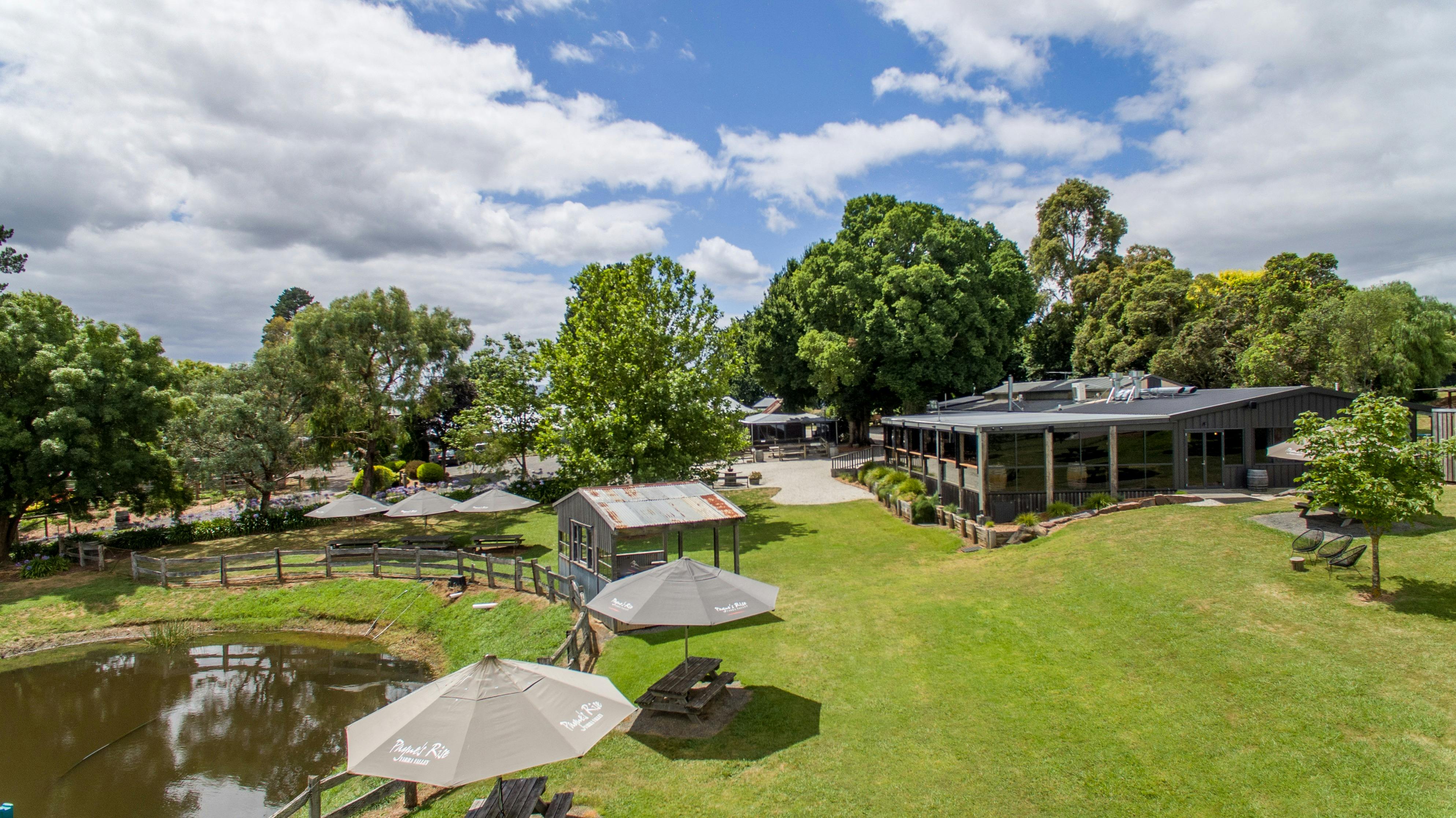 Aerial shot of Paynes Rise Winery, with the function space to the right and a water body to the left