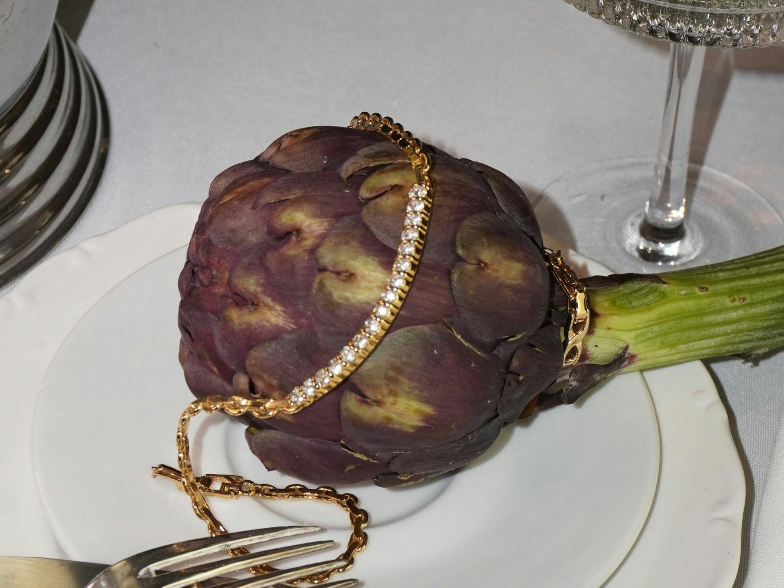 gold sparkly necklace on artichoke