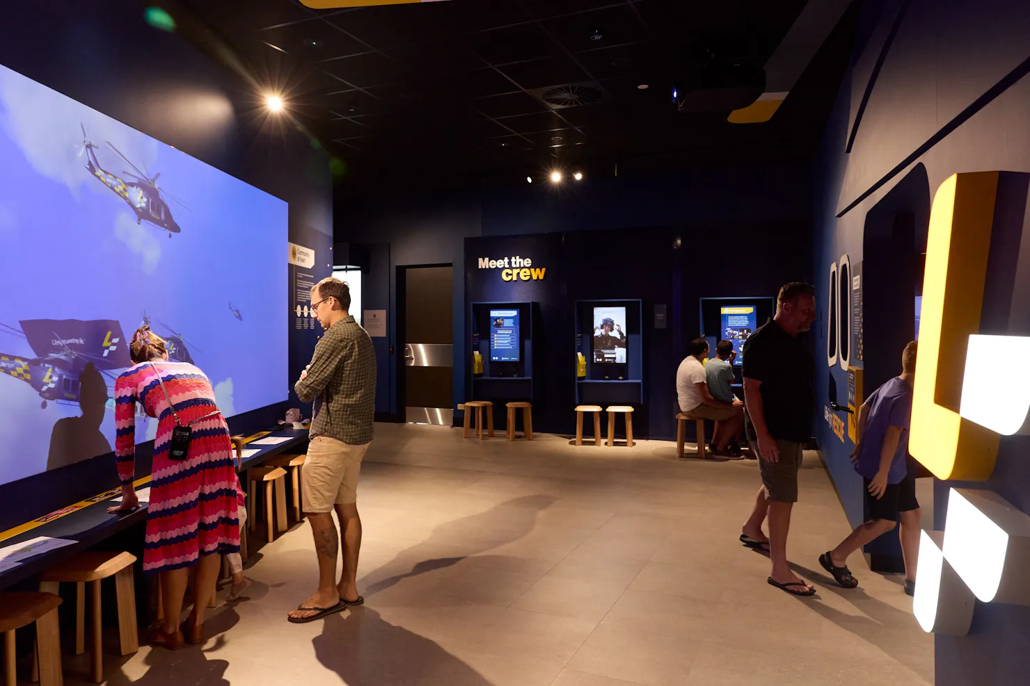 Families walking through and exploring the visitor centre