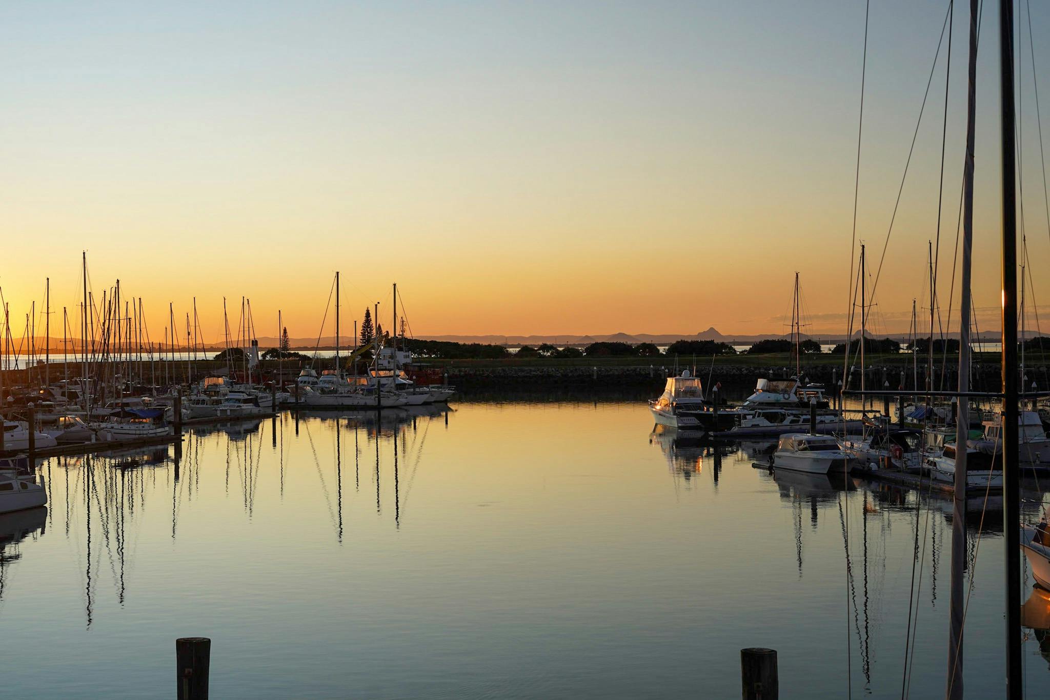 Sunset from the venue showing boats in the harbour