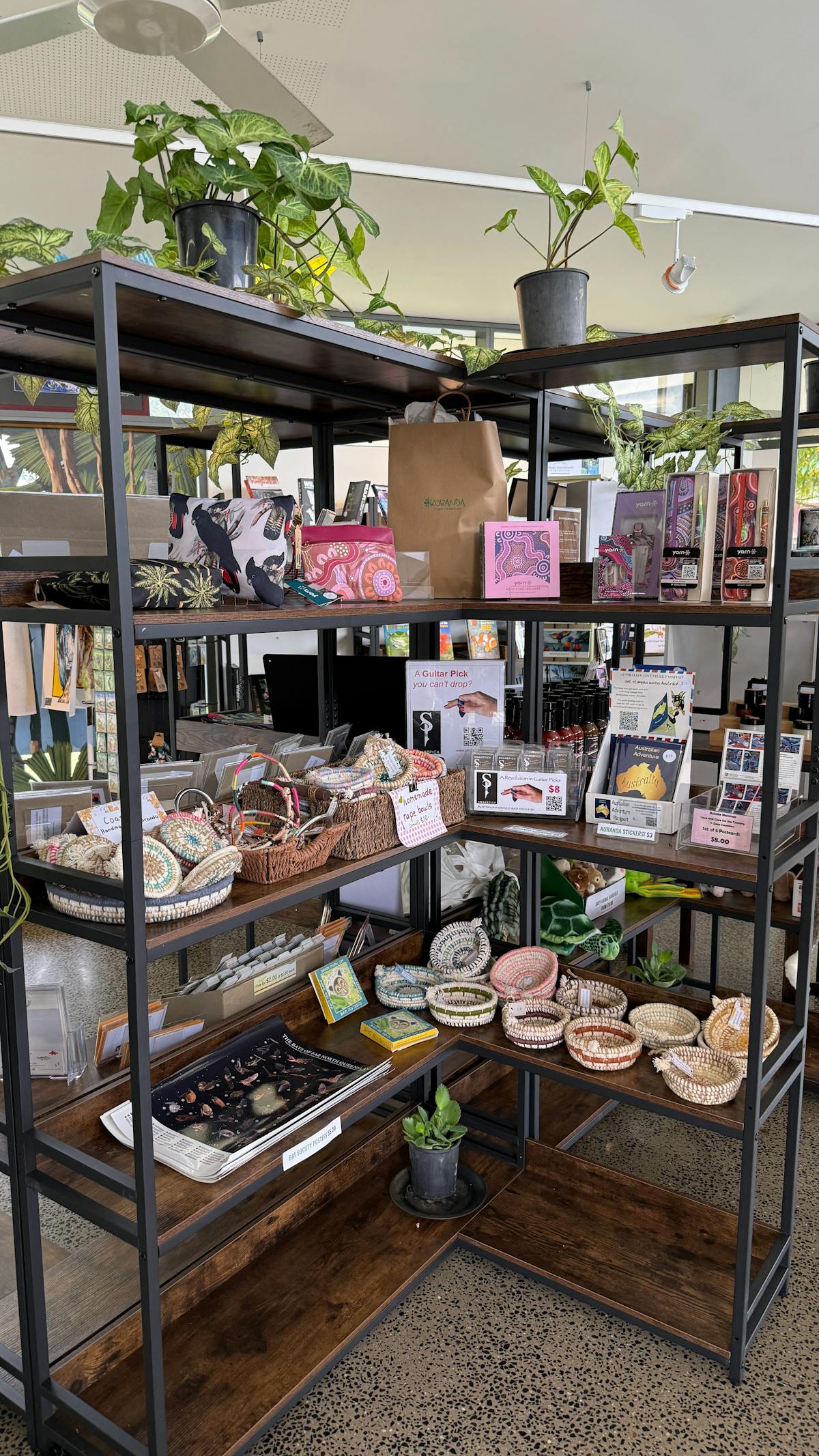 Shelving with various tourism and local craft products.