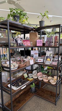 Shelving with various tourism and local craft products.
