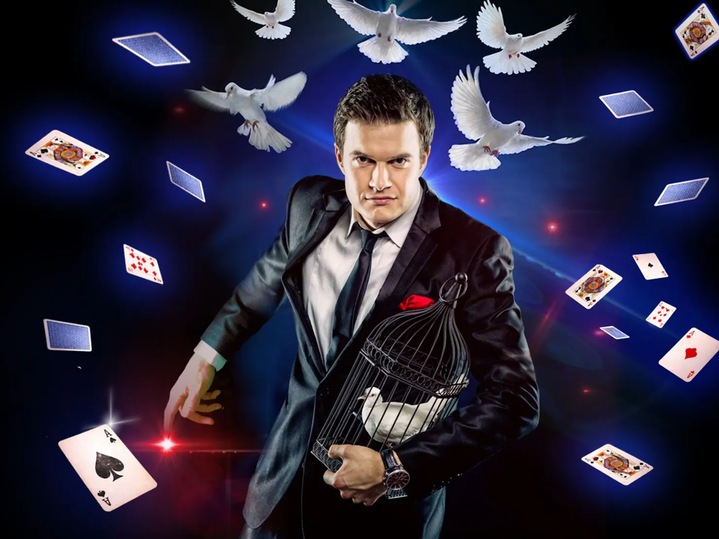 Man in suit and black tie with playing cards and birds flying around him