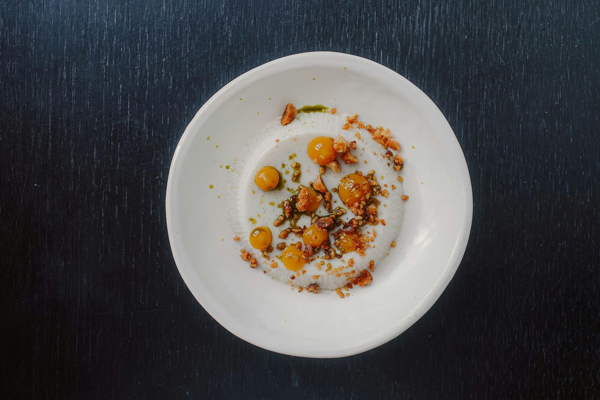 Coconut pannacotta, Geraldton wax, macadamia, yuzu sesame