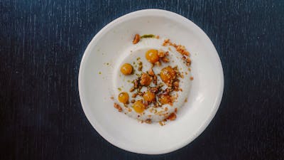 Coconut pannacotta, Geraldton wax, macadamia, yuzu sesame