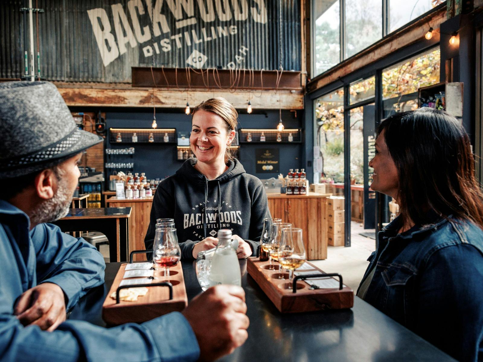Visitors enjoying a tasting at the distillery door