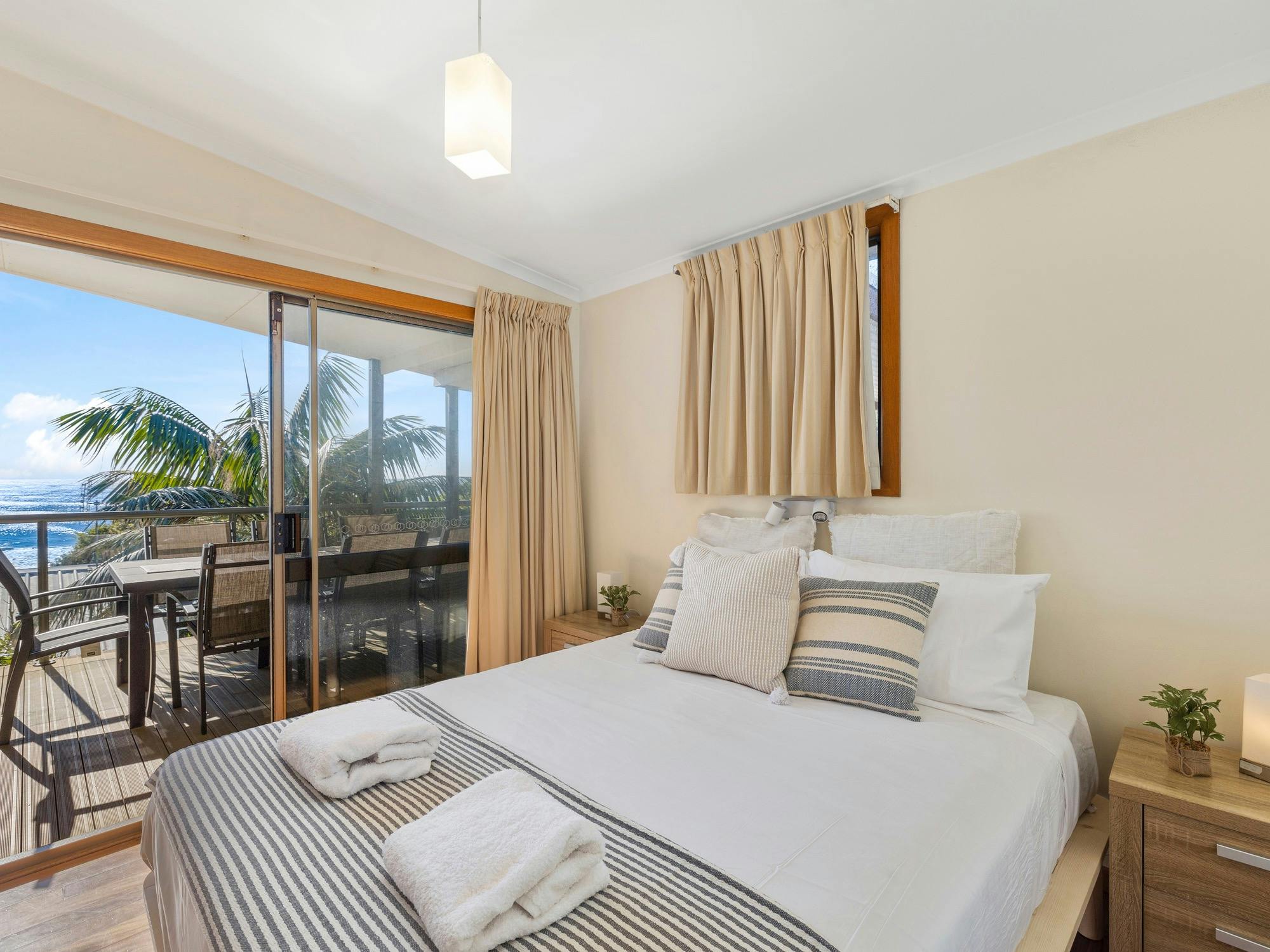 Main bedroom with access to the deck and ocean views