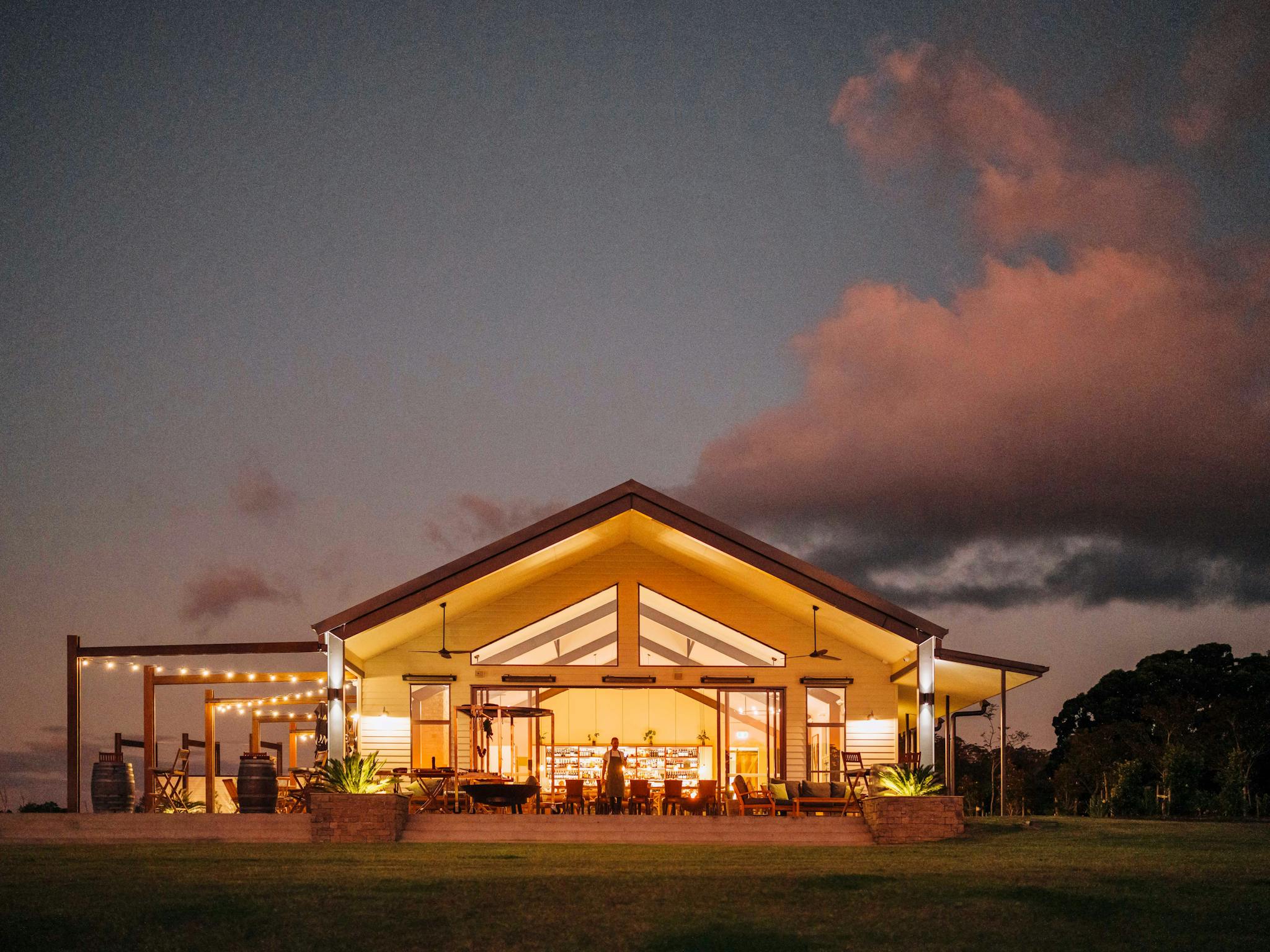 The Paddock restaurant exterior at sunset, Hazelwood Estate The Paddock restaurant exterior at sunset, Hazelwood Estate
